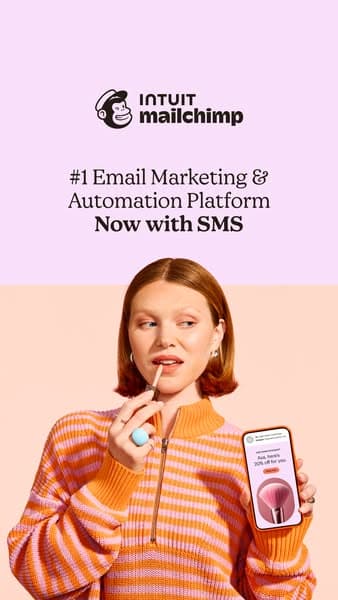 A vertical advertising banner features soft pink and peach backgrounds with the Intuit Mailchimp logo at the top and text reading "#1 Email Marketing & Automation Platform Now with SMS," below which a woman in an orange striped sweater applies lipstick while holding a phone showing a message, all on a Facebook ad spac…