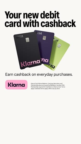 Advertising banner with a light background shows three Klarna debit cards in black, dark purple, and green, with headline text "Your new debit card with cashback" and subtext "Earn cashback on everyday purchases," plus a pink Klarna logo button.