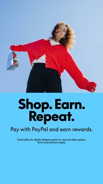 A smiling woman in a red cardigan holding a shopping bag against a blue sky with a blue background below displaying the text "Shop. Earn. Repeat. Pay with PayPal and earn rewards. Check offers for details. Redeem points for cash and other options. Terms and exclusions apply.