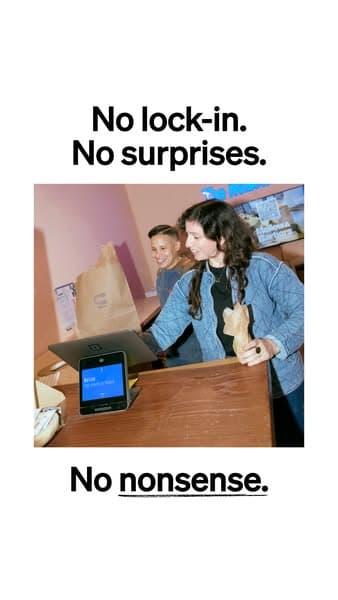 Advertising banner with a photo of two people smiling at a checkout counter using a Square device, surrounded by brown paper bags, with bold text reading "No lock-in. No surprises. No nonsense." in black on a white background.